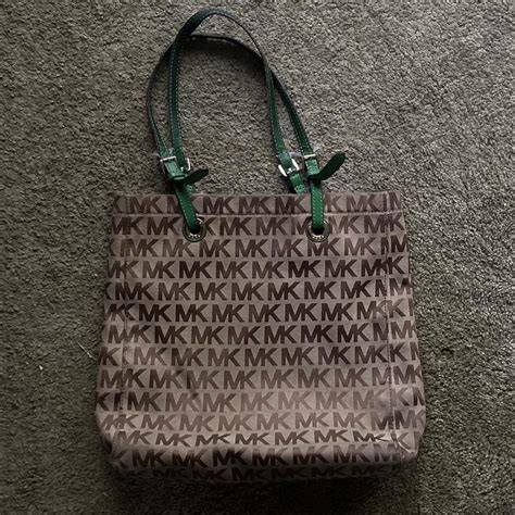 are letters on michael kors purse supposed to discolor|Michael Kors plastic tote bag.